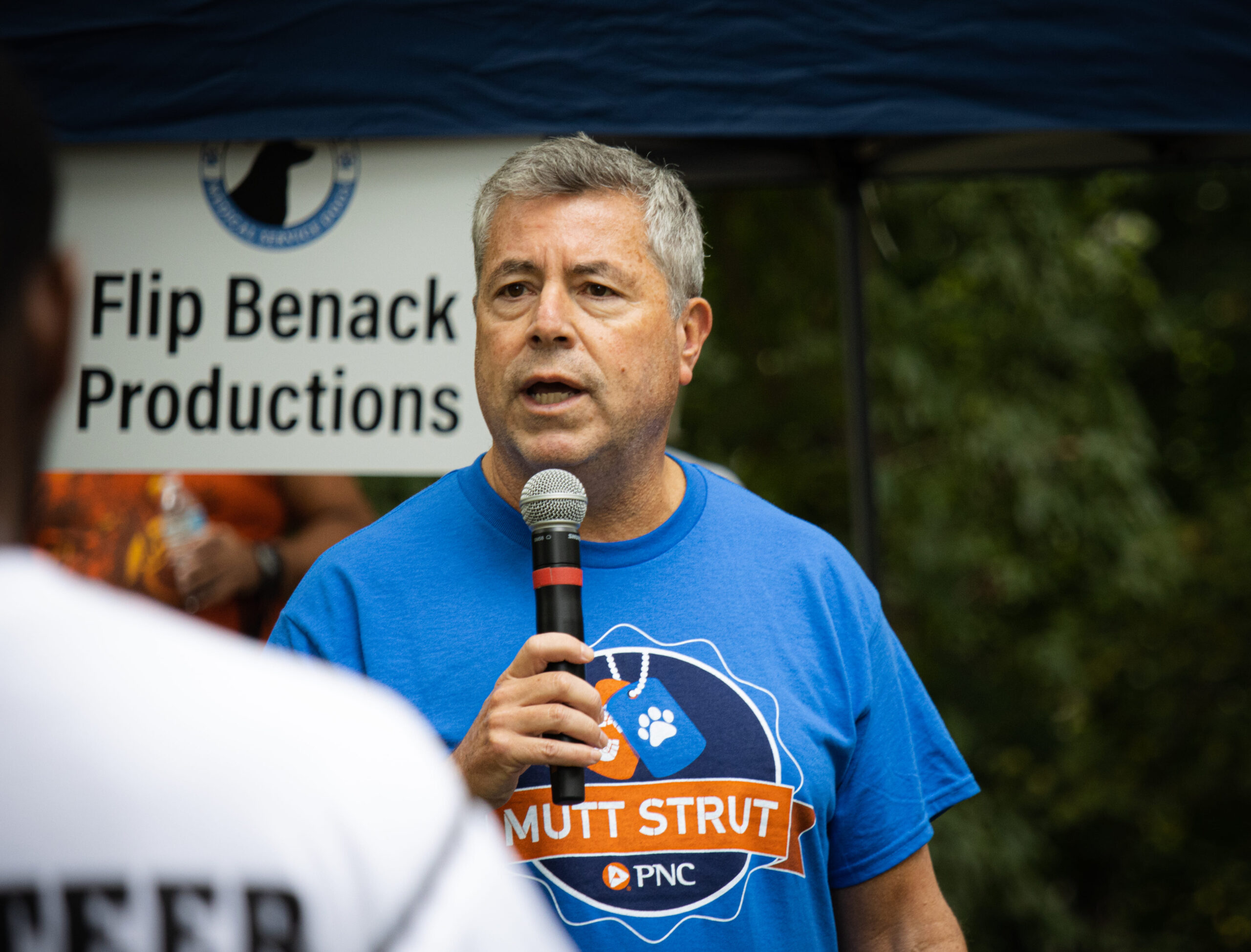 Man Speaking At Mutt Strut